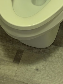 Stains around the toilet that looked like poop