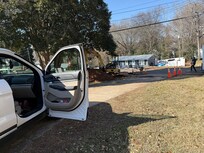 This points to end of driveway where we had to wait to leave and got a flat ftom stray metal.