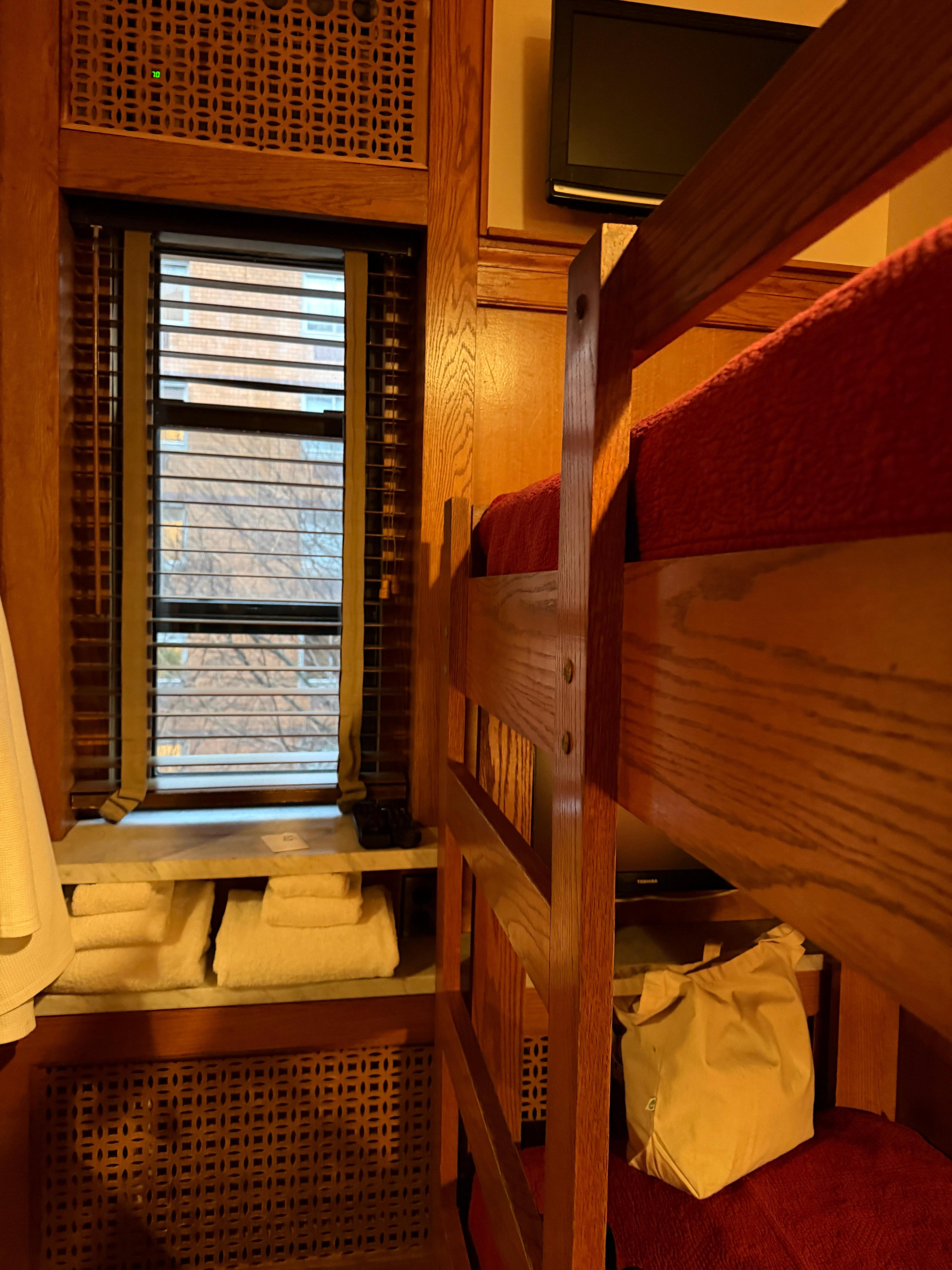 2 bunk beds, each with its own tv and just enough room to change and get into bed.