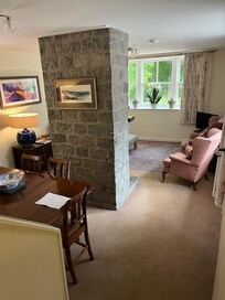 Living room and dining room with fireplace in the middle