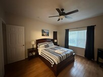 Master bedroom with large walk in closet overlooks back yard.