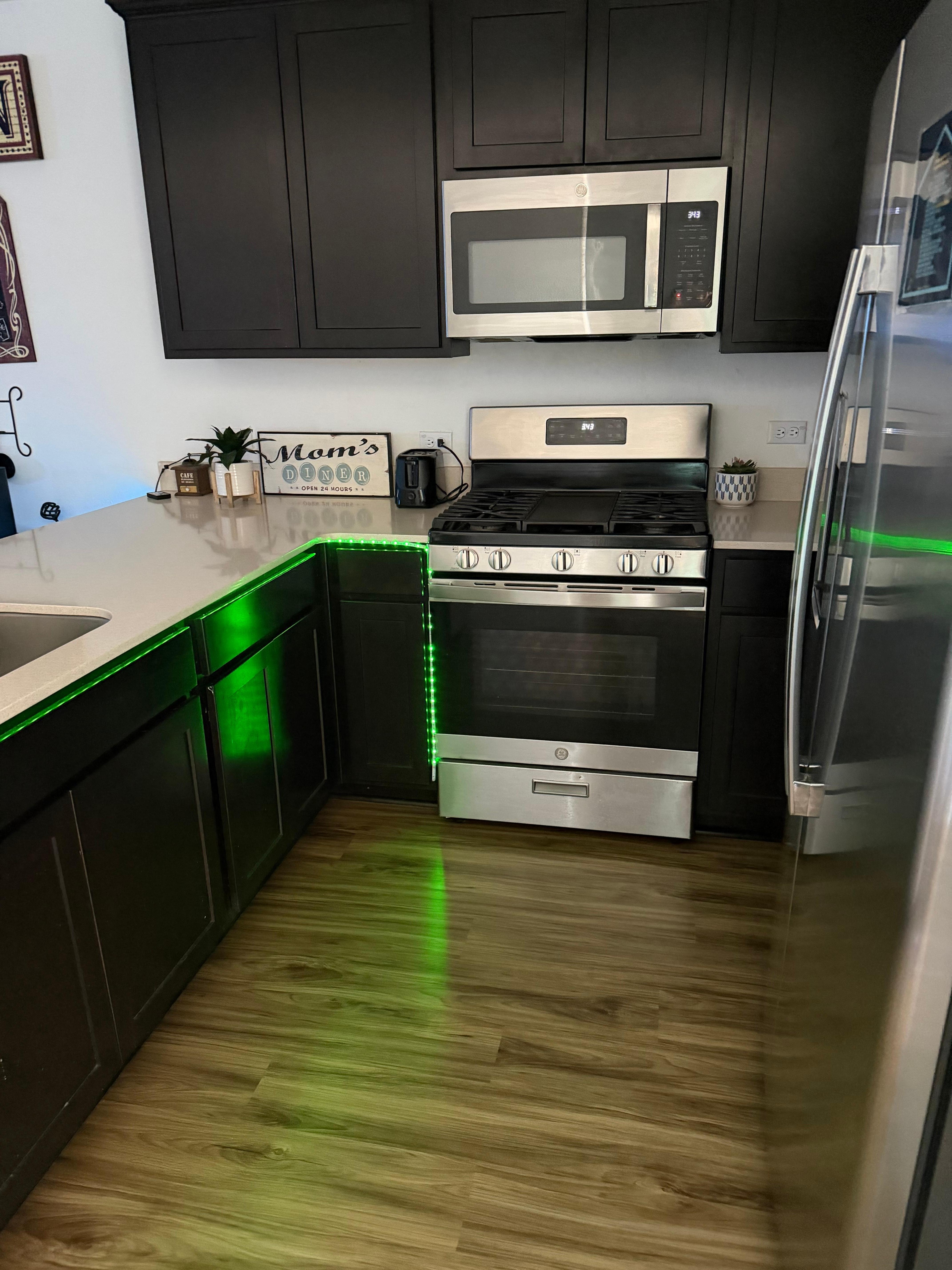 Kitchen includes a Gas stove, place settings for at least 6 people. Cooking pots, pans skillets, and a stove top griddle. Also, spatulas, tongs, serving spoons, & a small cutting board. I did NOT see any measuring cups though (if you need them).