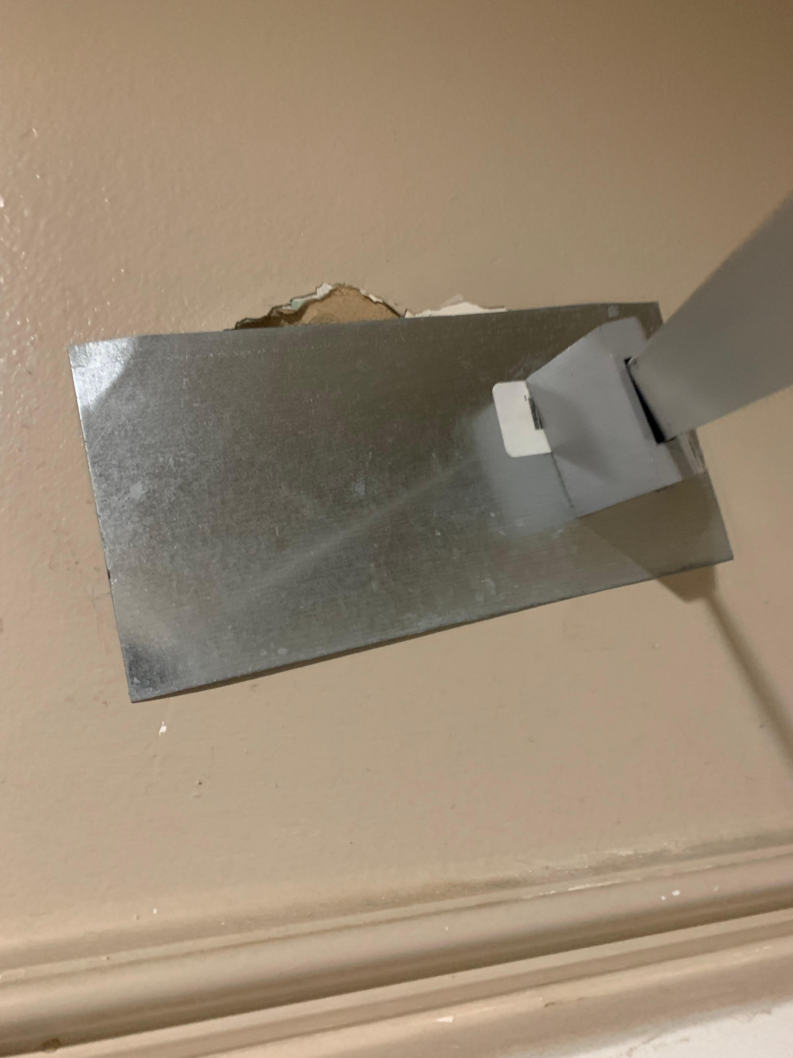 The other side of the shower holder wall