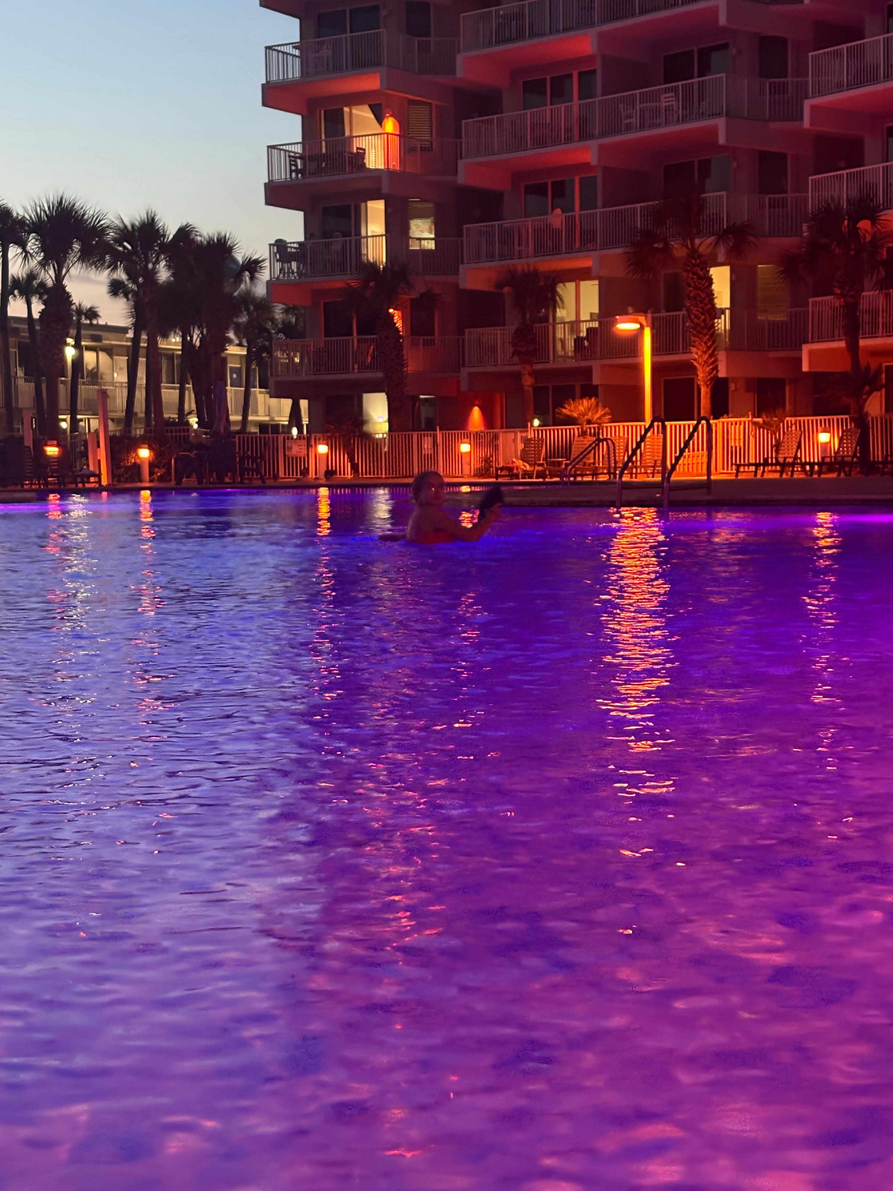 The pool is beautifully lit at night with changing colored bulbs!