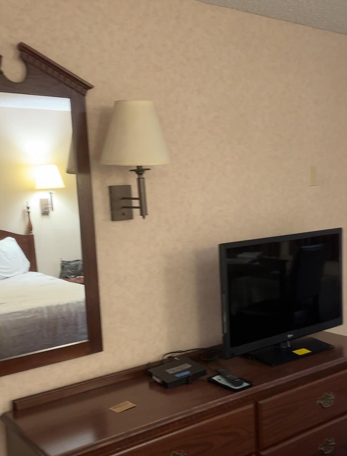 Very nice bedroom with older furnishings.
