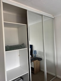 Wardrobe in bedroom, not as depicted in listing . One panel missing and one not attached at the top, so loose and potentially dangerous.