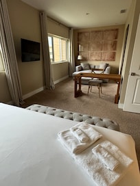 Bedroom One with desk and chaise sofa