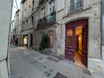 The apartment is via the red door, and the patisserie 2 doors down.