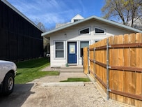 Parking space and entry door.