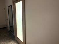 frosted glass door to bathroom - across from beds - and there's no nightlight in room or bathroom