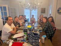 Long kitchen table with games, coloring, and crafts