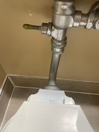 The toilet is pretty out dated.