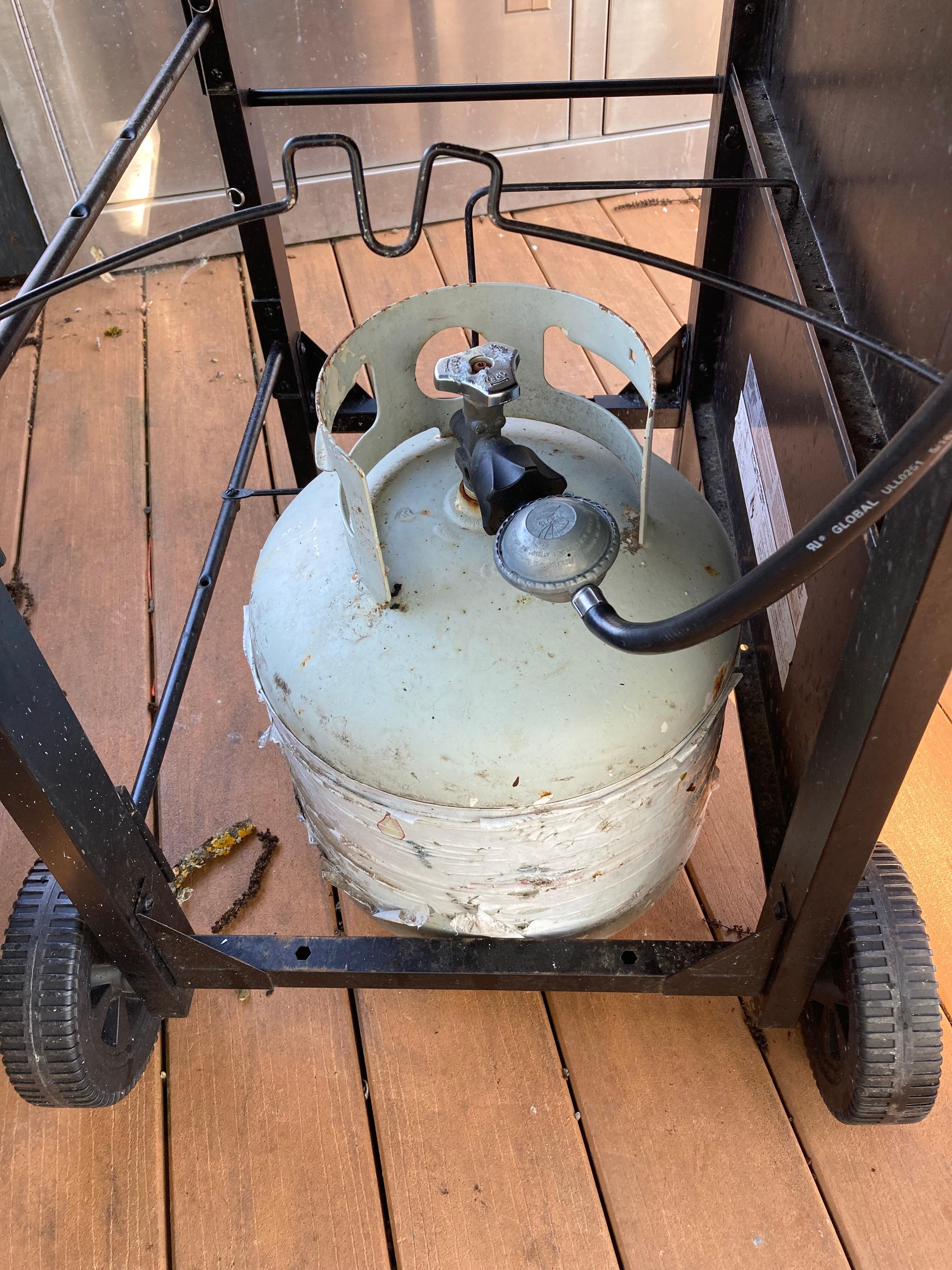 The grill maxed at 180 degrees due to caked burners and misconnected propane tank.