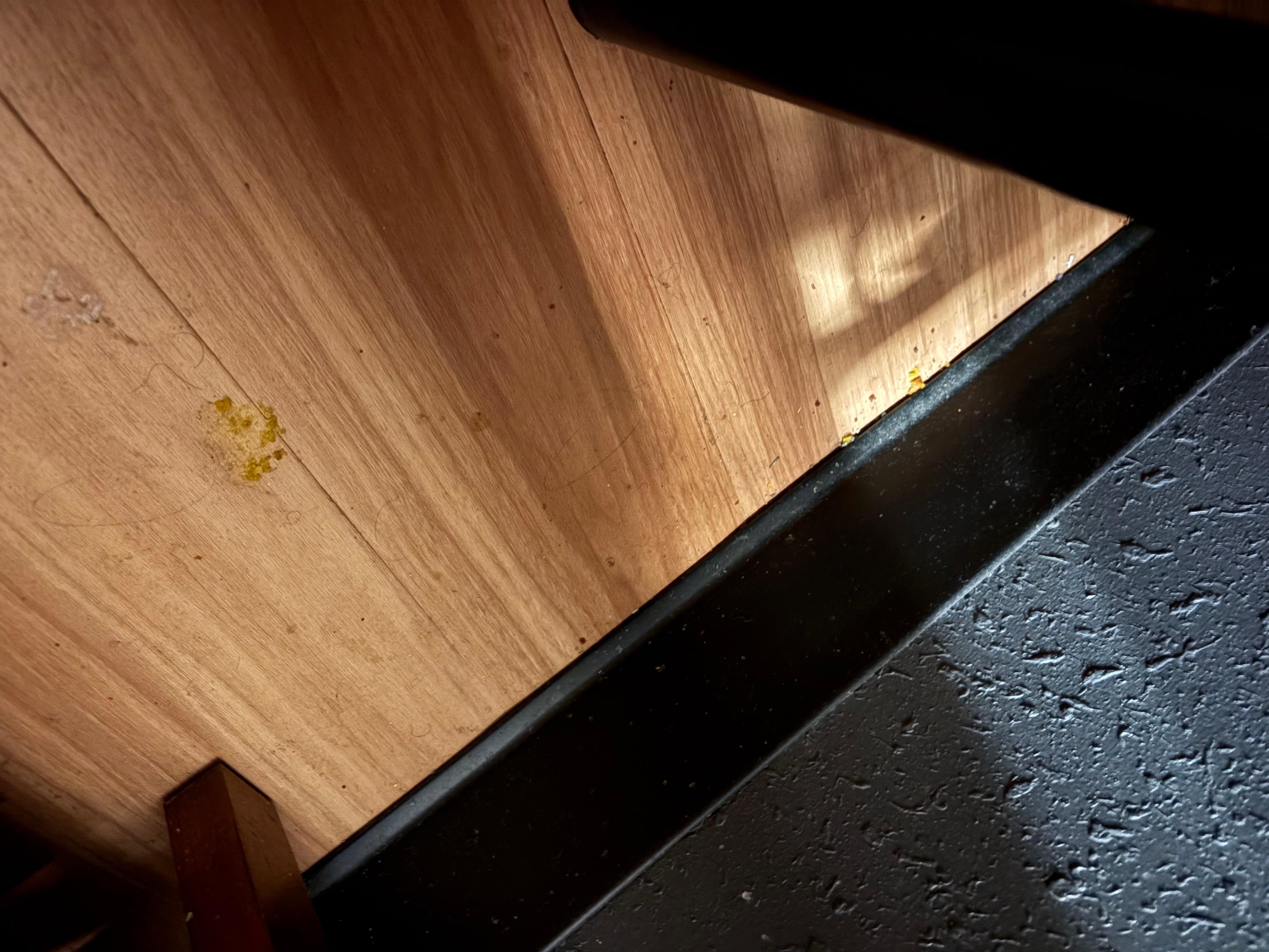 Beside the bed table, not sure what it was but the floors were gross. 