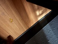 Beside the bed table, not sure what it was but the floors were gross.