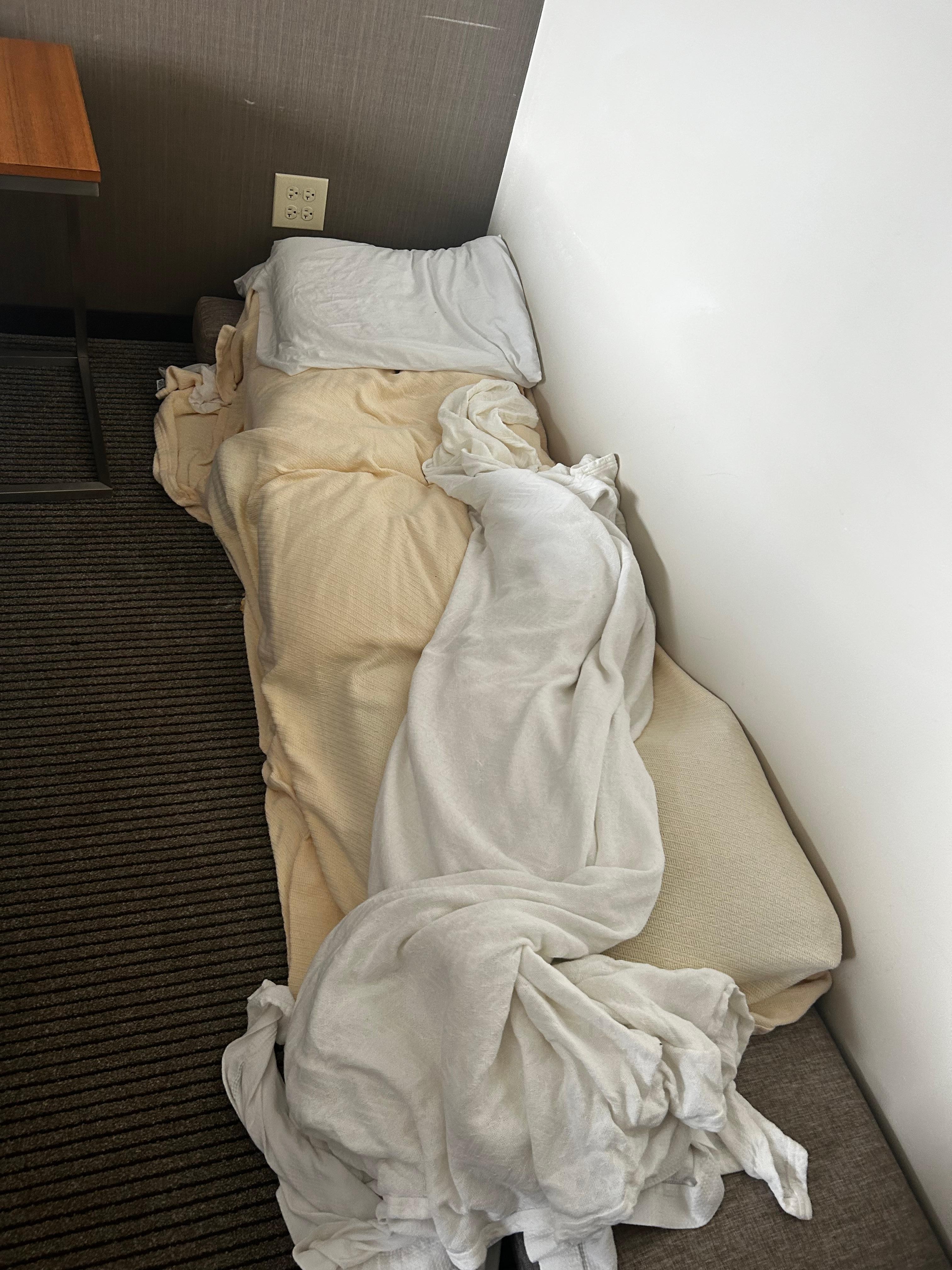 a bed, made out of pillows from the room that I had to move out of