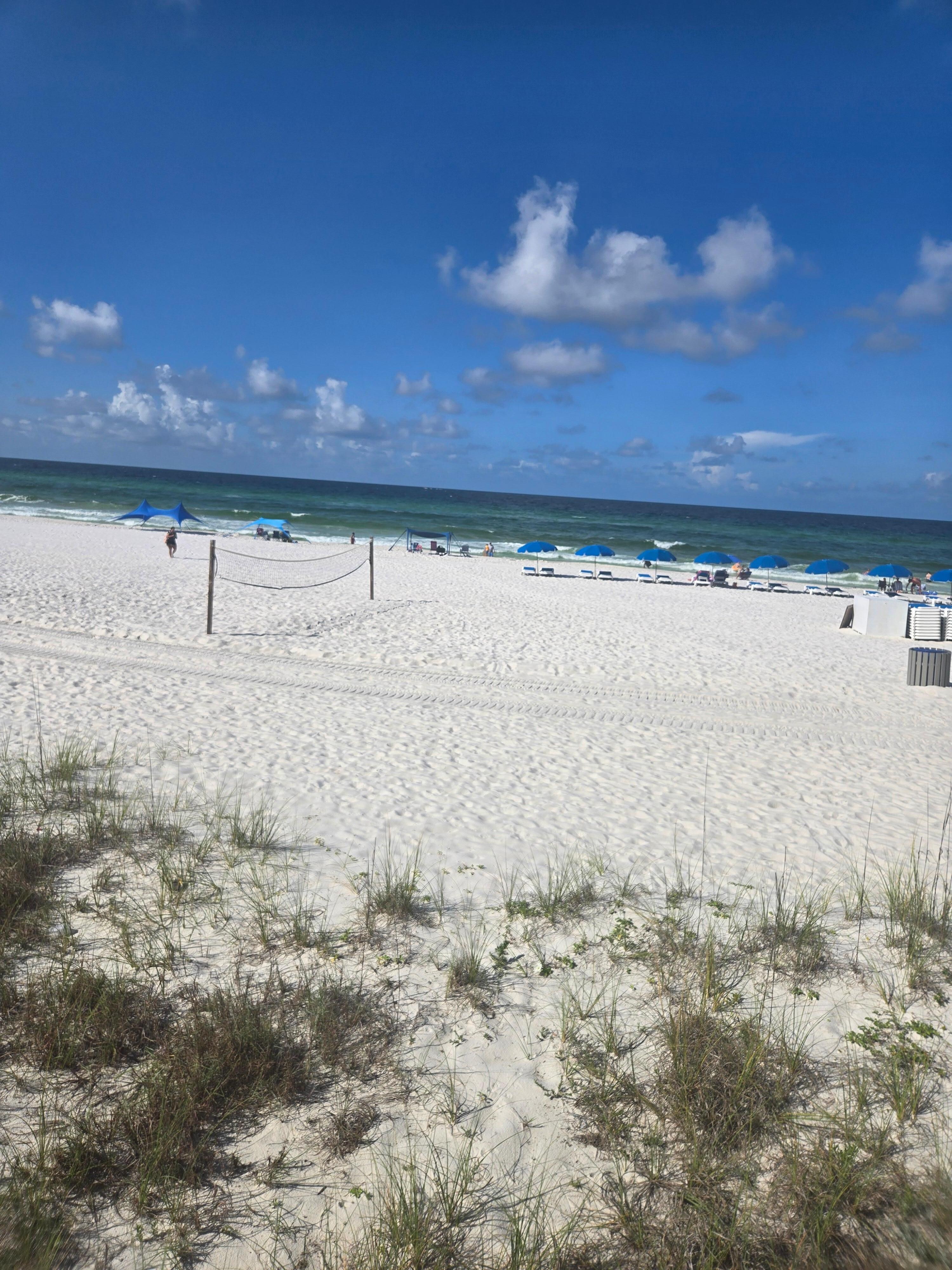 The beach right outside the pool area