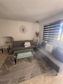 The living room sofas, nothing like a bench to sit on!