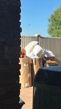 Pillows in open boxes behind building