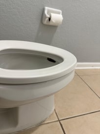 Another photo further back of the toilet