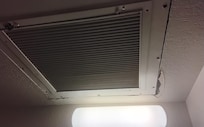Cut out in ceiling above vanity area.