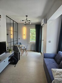 The living room with dining