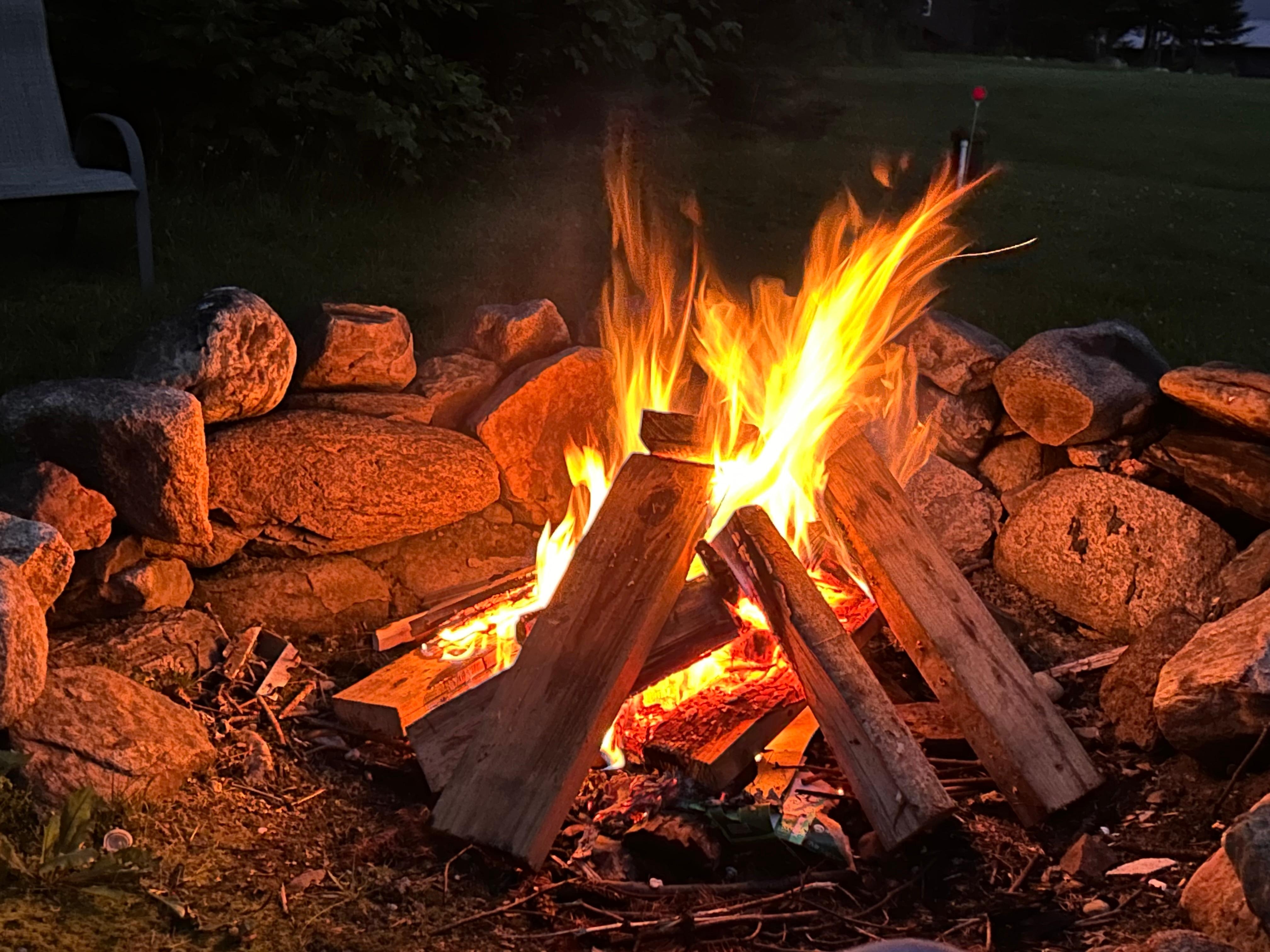 Campfire in large rock fire pit