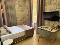 My clean and wonderful room with a fantastic balcony and view of the yachts and street below.