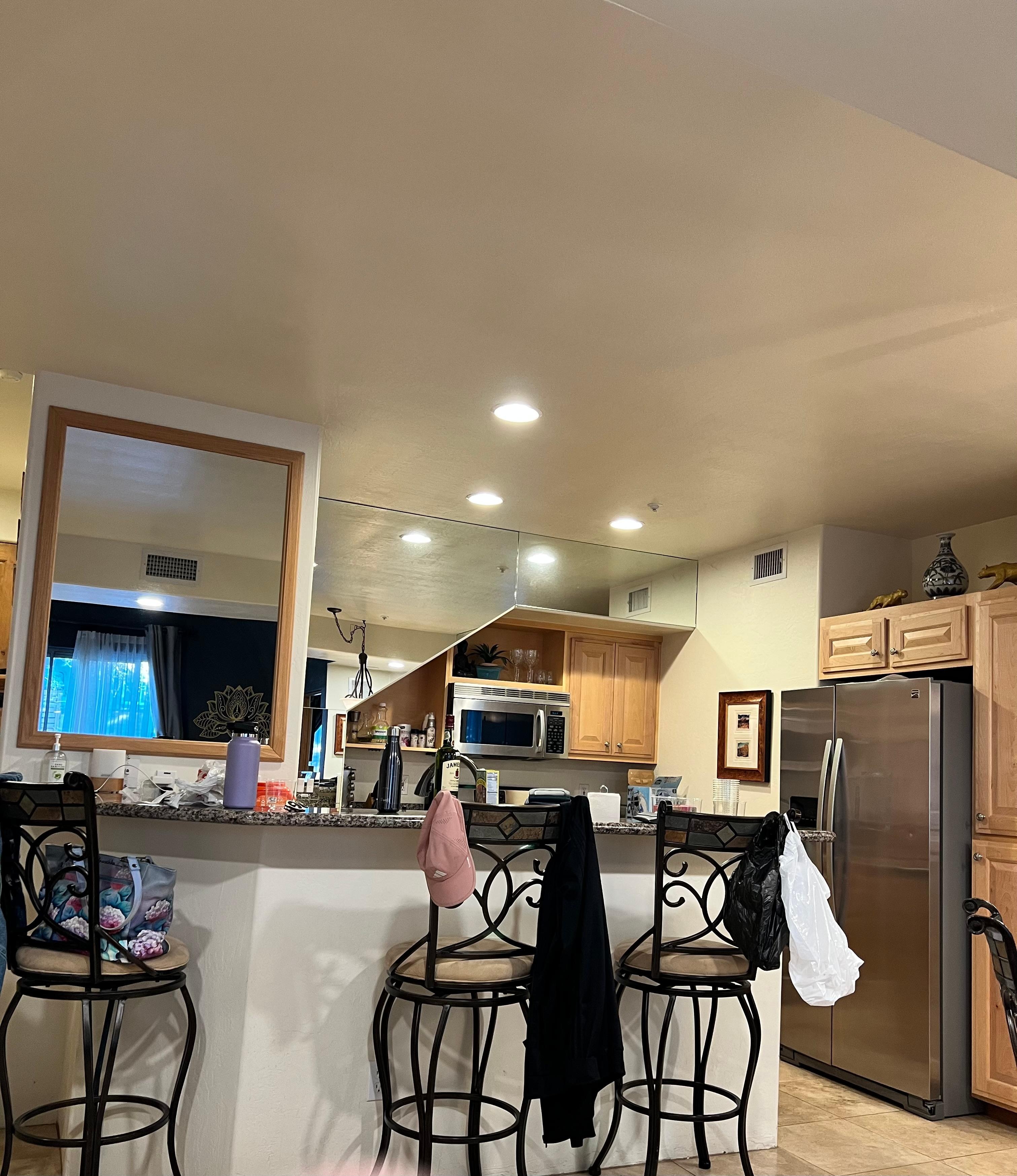 Kitchen with high top and bar stools