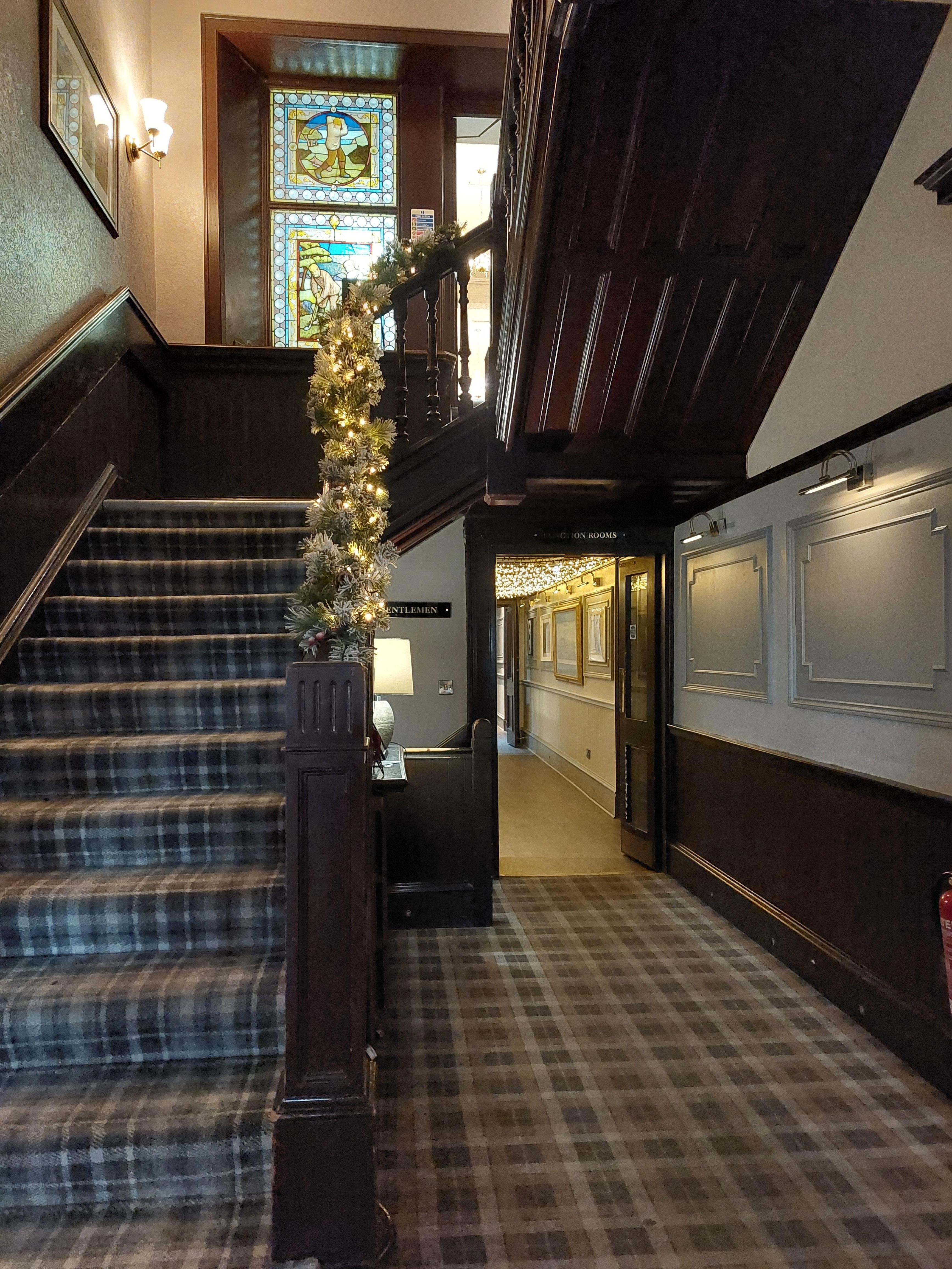 Festive additions to reception areas on top of Scottish themed stained glass or frosted windows with portraits of Scottish historical characters and events along the corridors