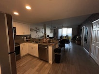 Great full kitchen with Ninga Blender, Large Refrigerator, Oven, Dishwasher & Laundry
