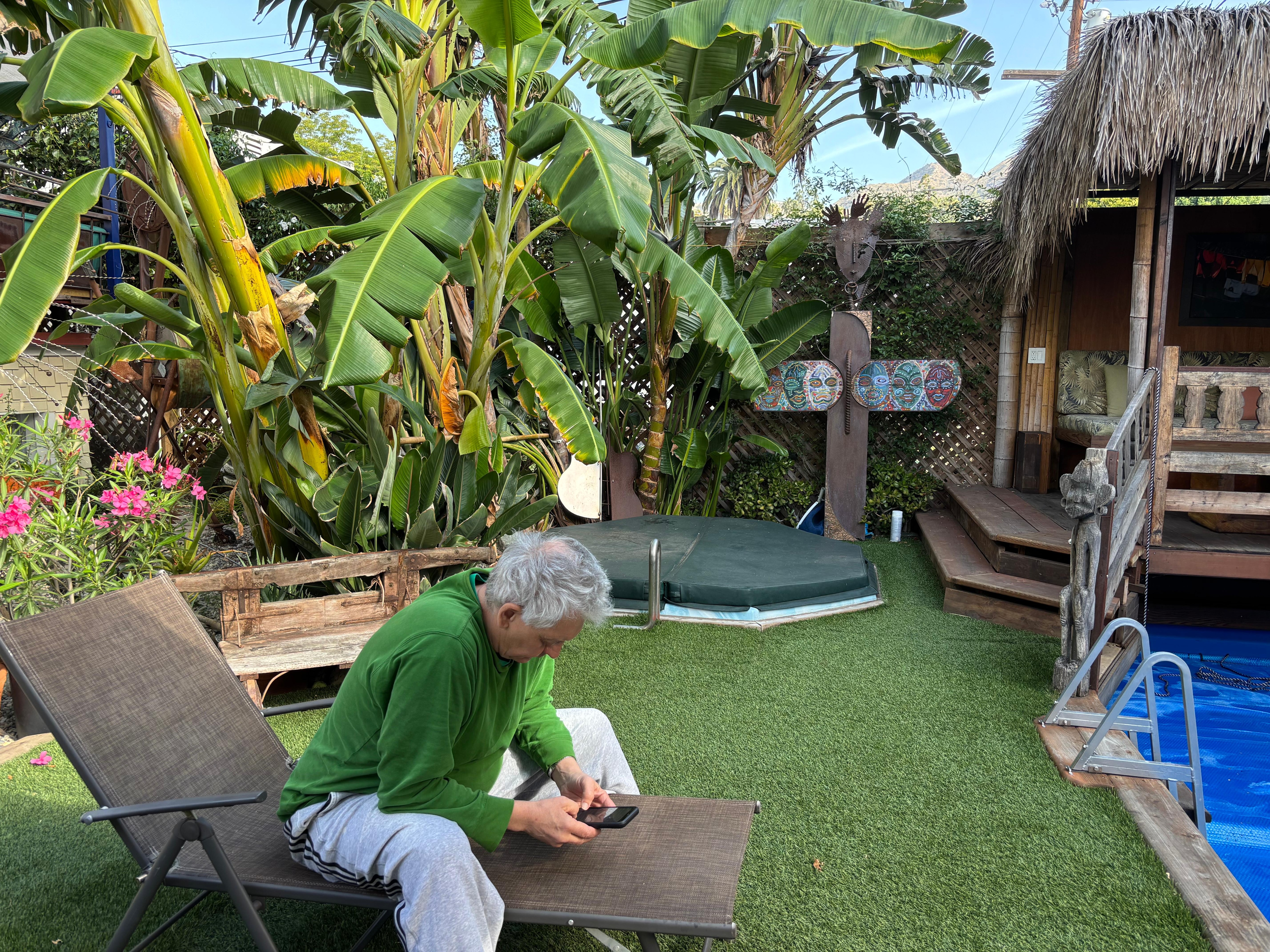 Backyard by hot tub and cabana