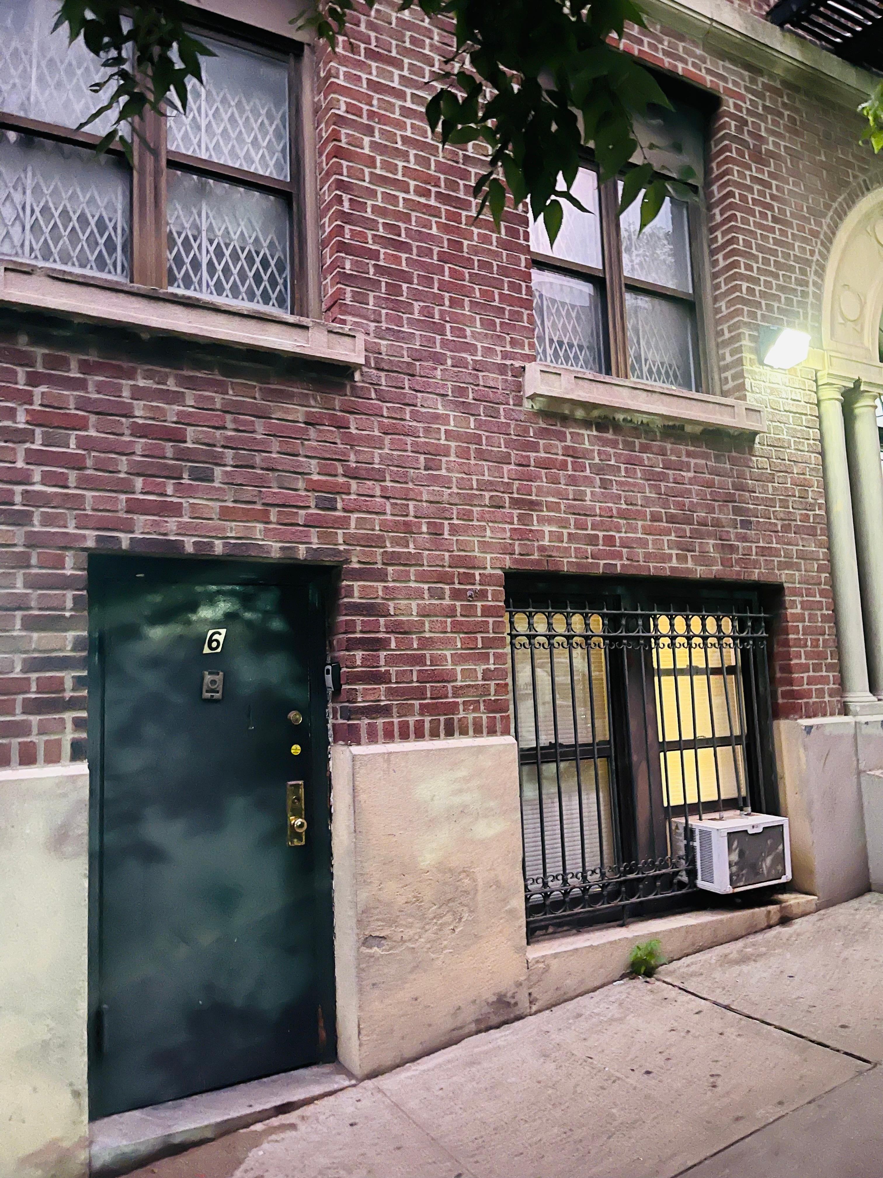 Front Door. Apartment is on bottom level. The windows overlook alley and sidewalk.