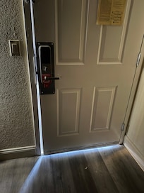 Image of room door, locked and shut completely.
