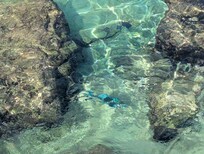 Water so clear. Lots of fish!