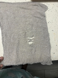 Face towel in room, torn and was not going to use.