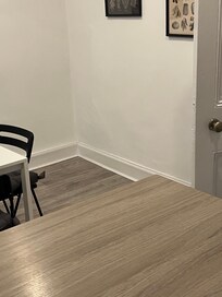 Dead space where you could put two seater sofa and a TV on the wall would be Much better