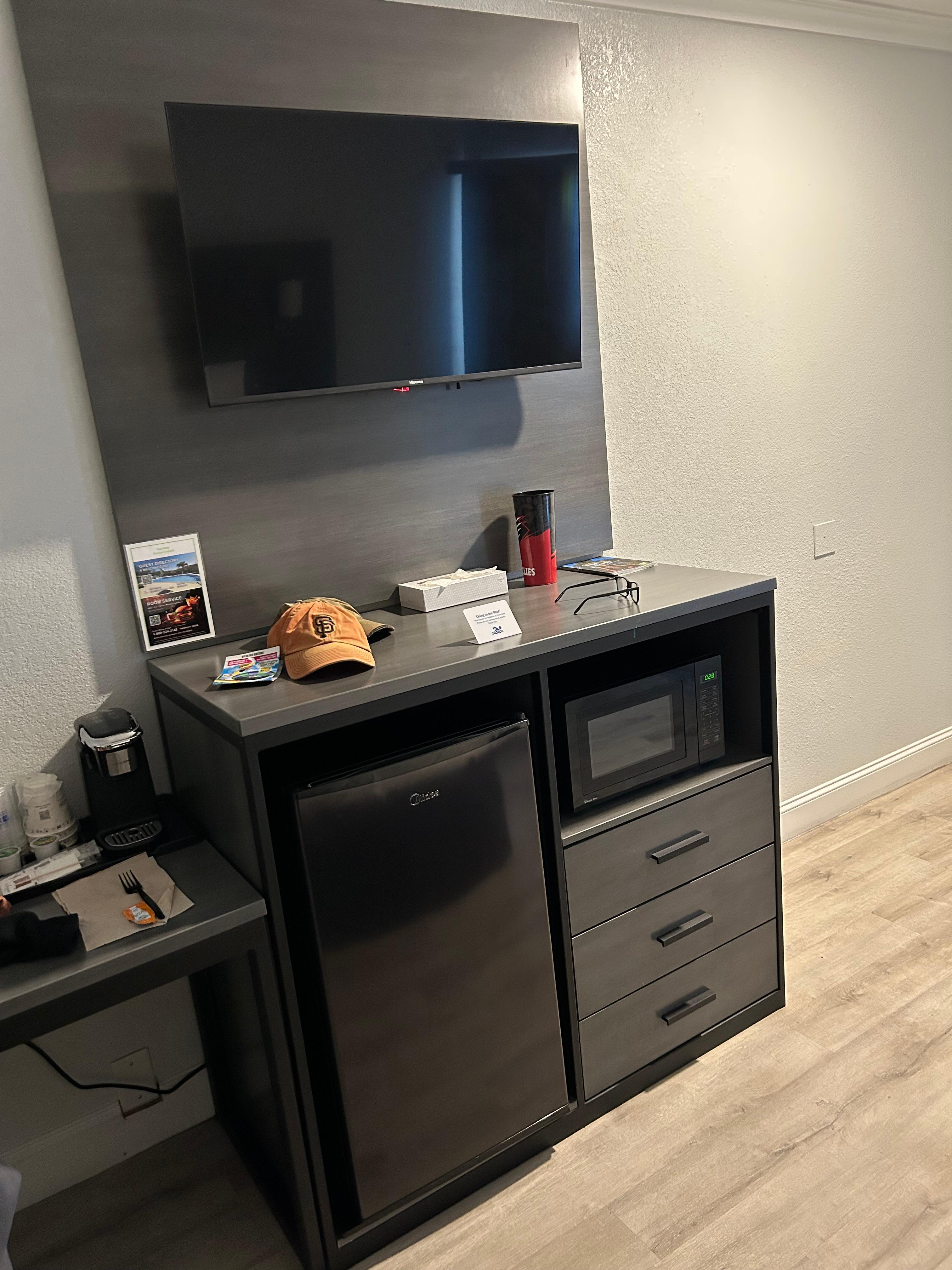 very nice fridge and TV with multiple channels
