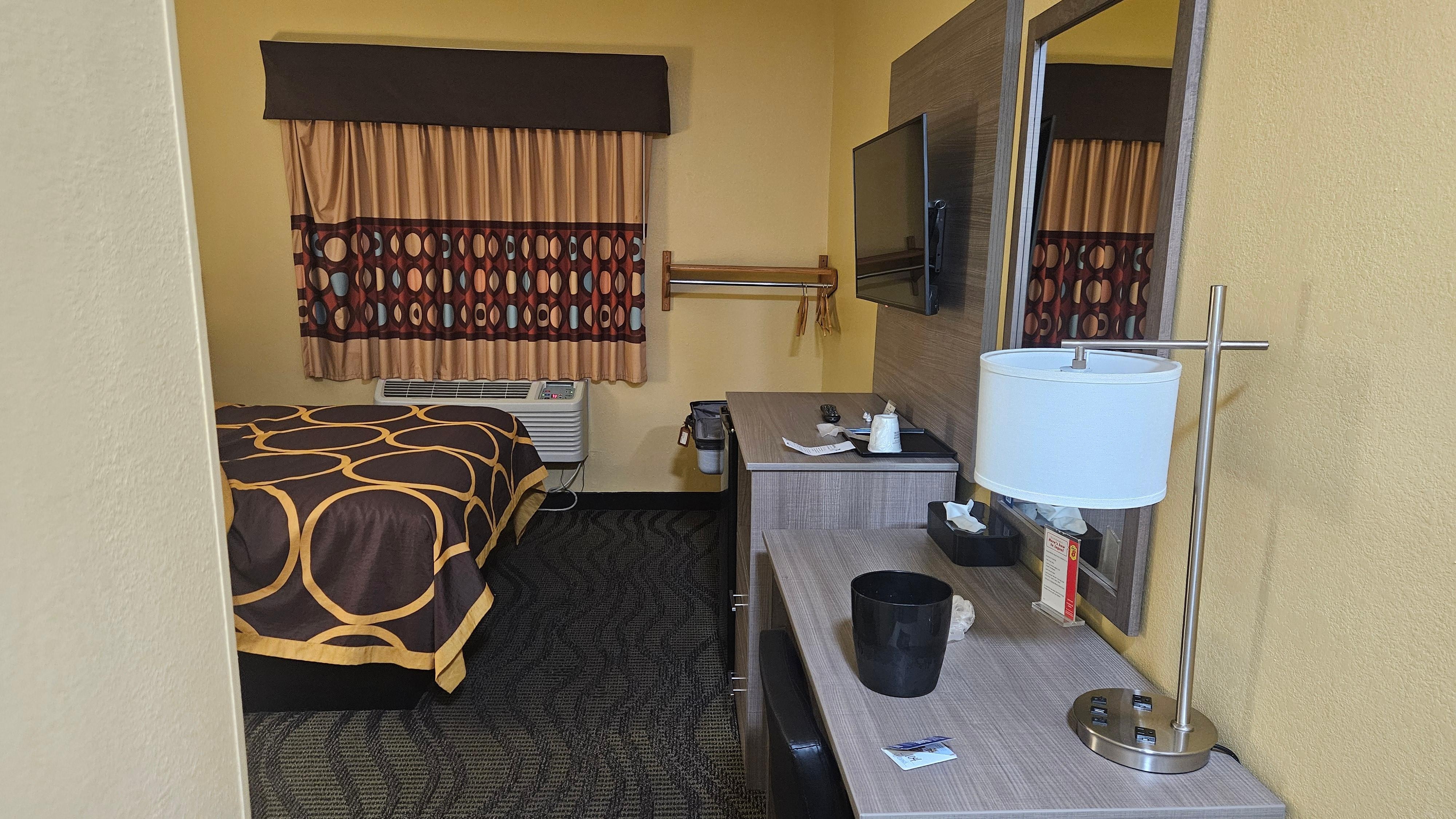 Room amenities include TV, fridge, & microwave.