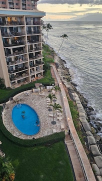 View of the pool and BBQ grills from the room