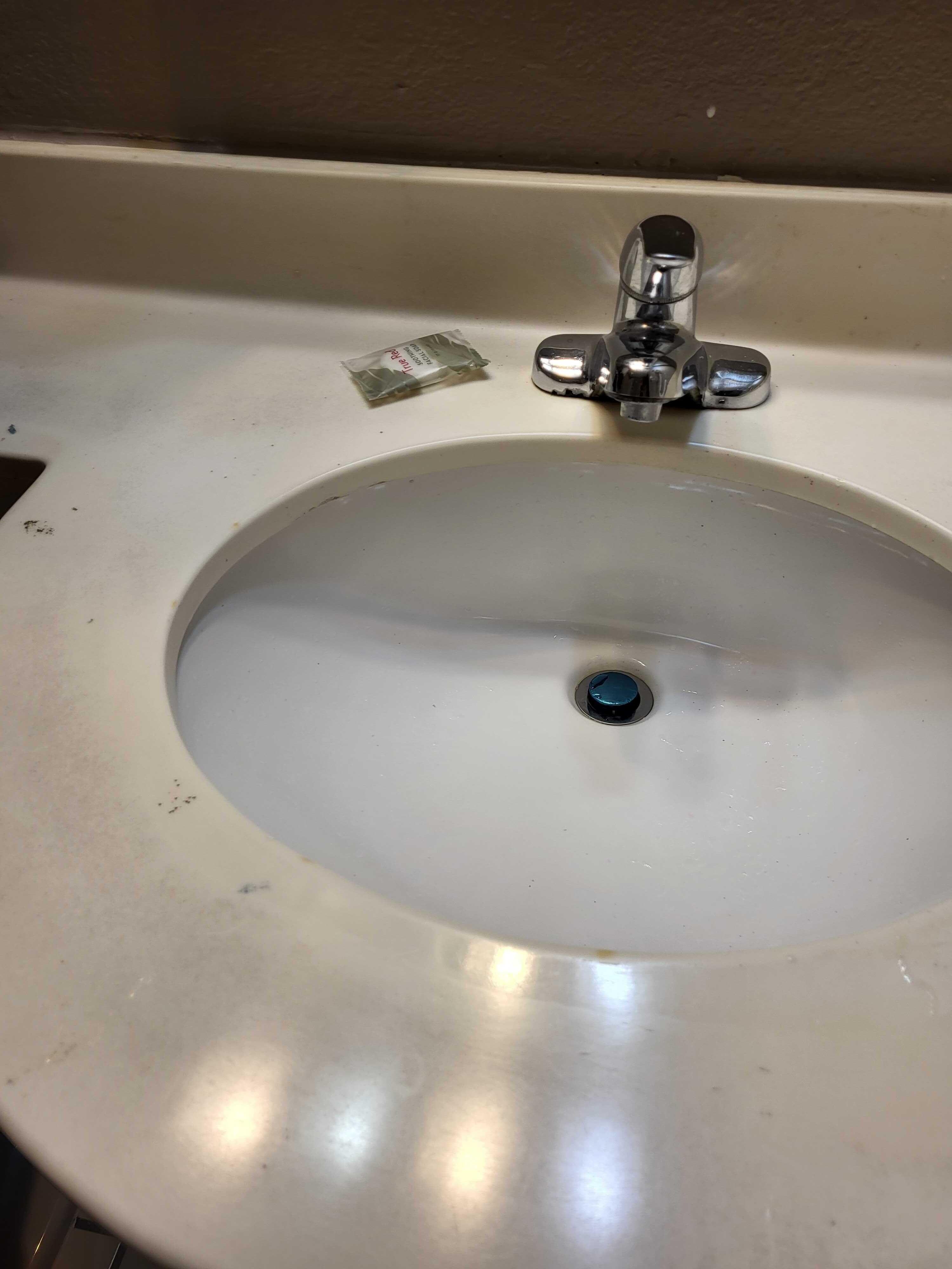 Cigarette burns + paint & glitter on sink