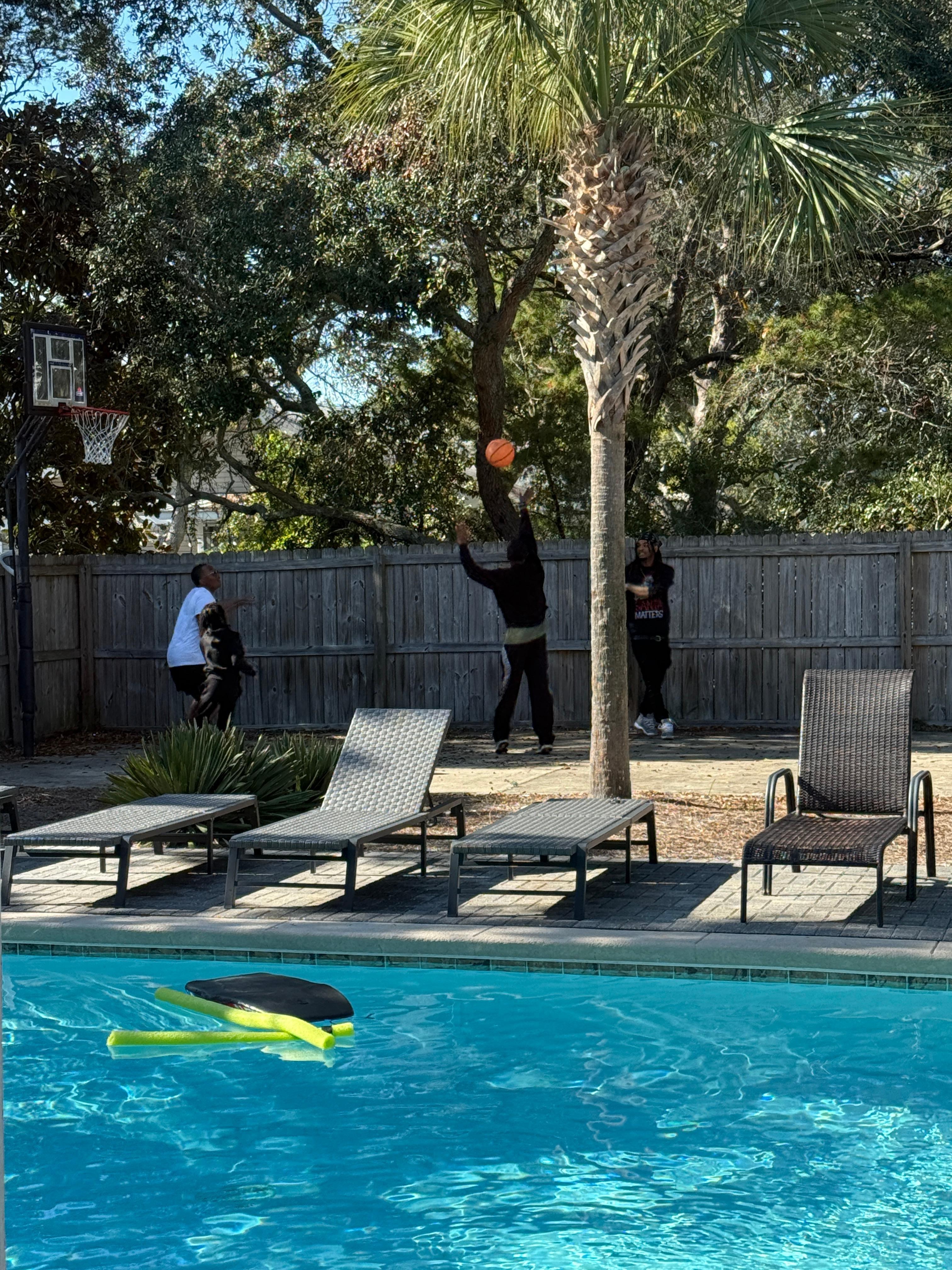 Pool and basketball goal during the day
