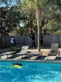 Pool and basketball goal during the day