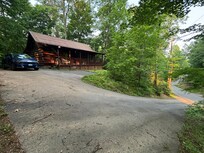 Paved road leading up to cabin