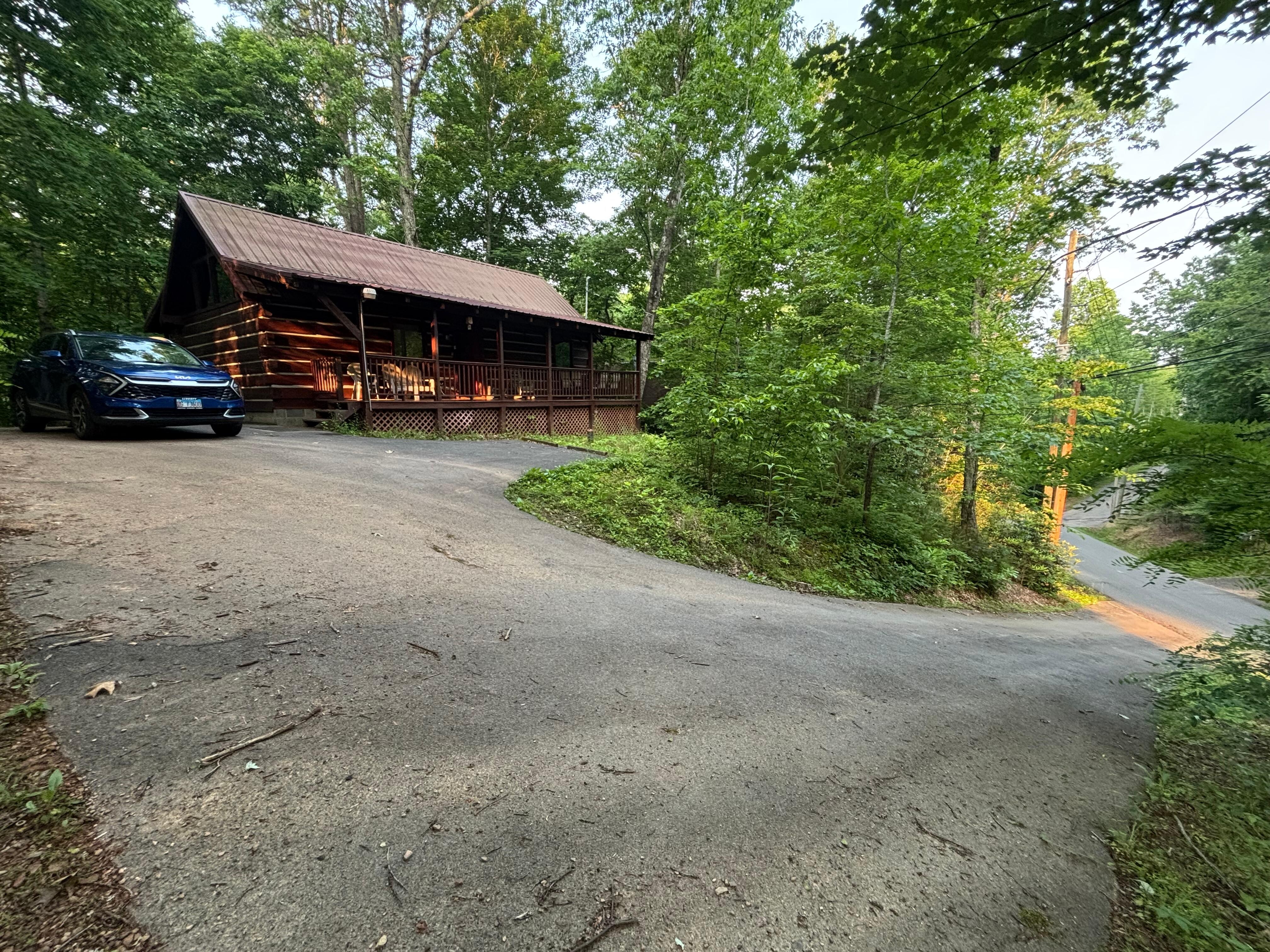 Paved road leading up to cabin