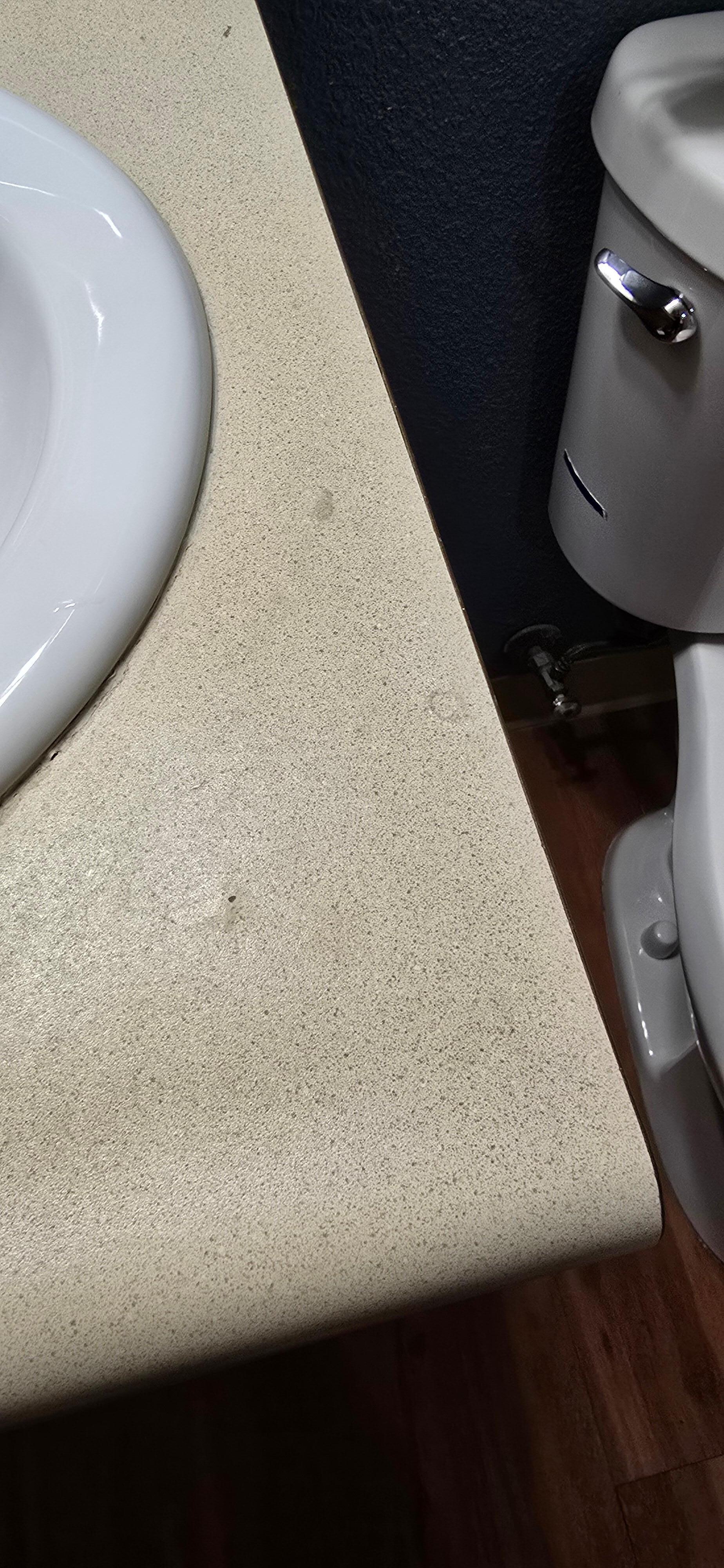 Unclean countertop in bathroom.