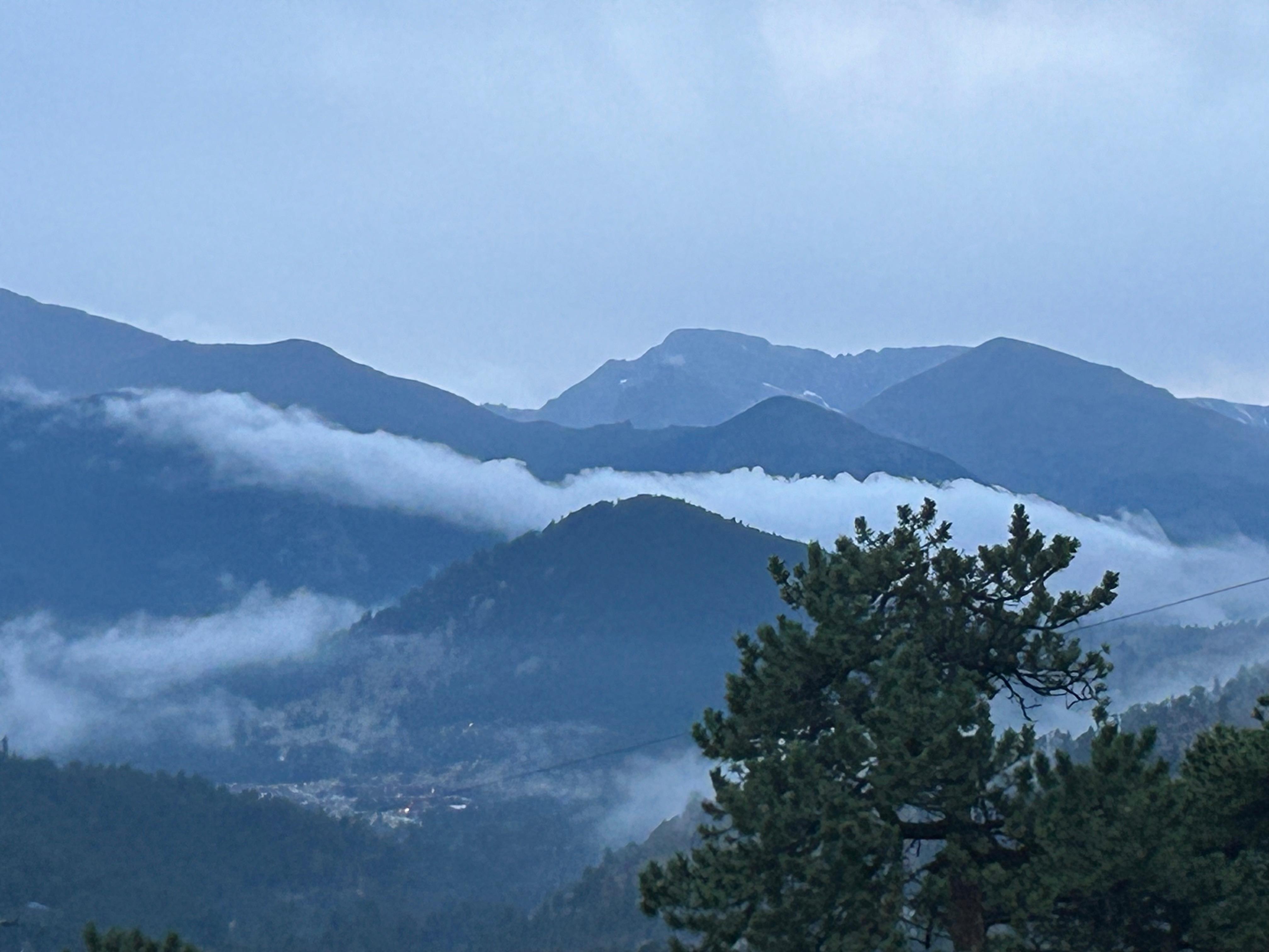 Longs Peak covered in clouds from the deck