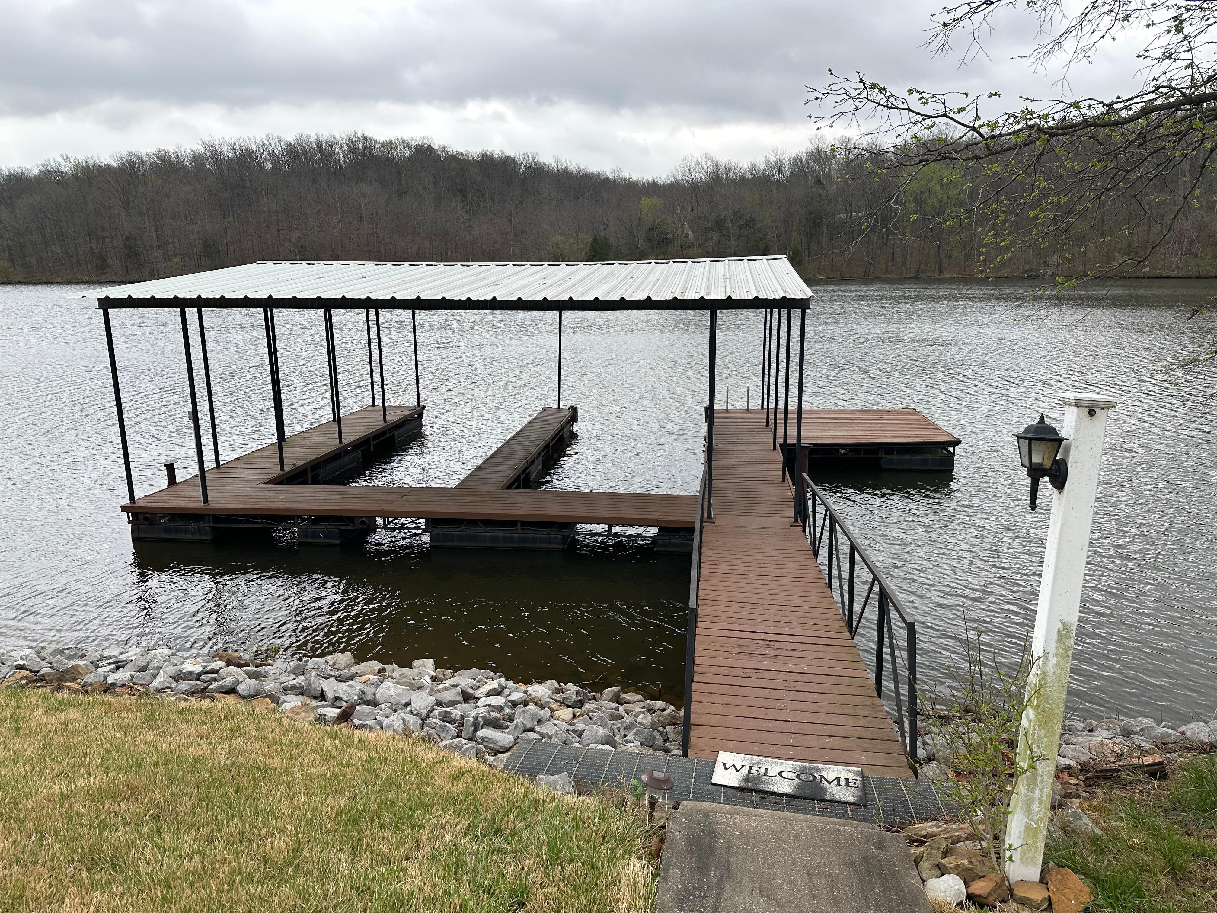 Nice dock/slips.  Lots of space on property to park a boat trailer and vehicles.