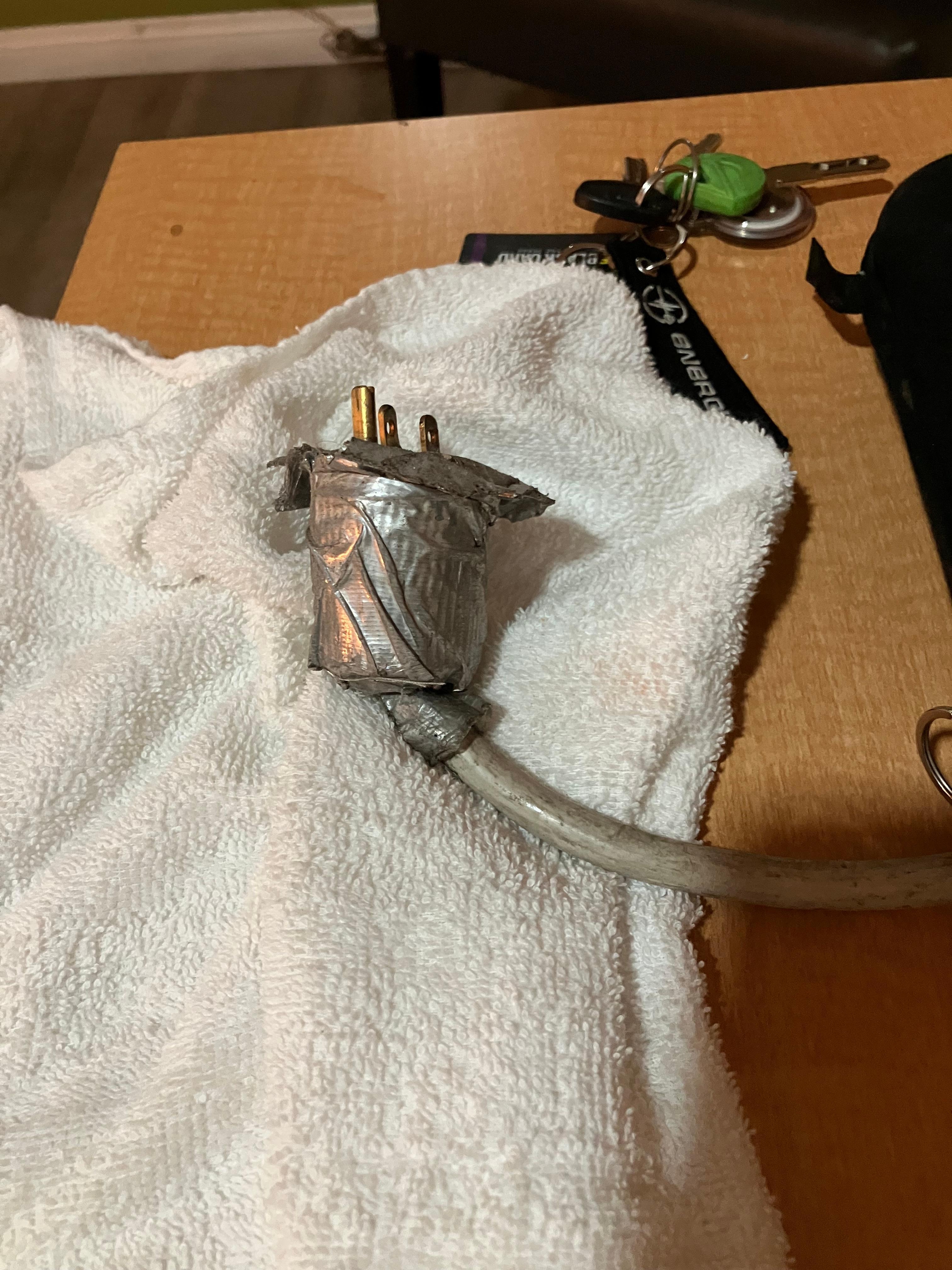 A/C, Nema 6-20 plug - badly damaged.
Very dangerous.