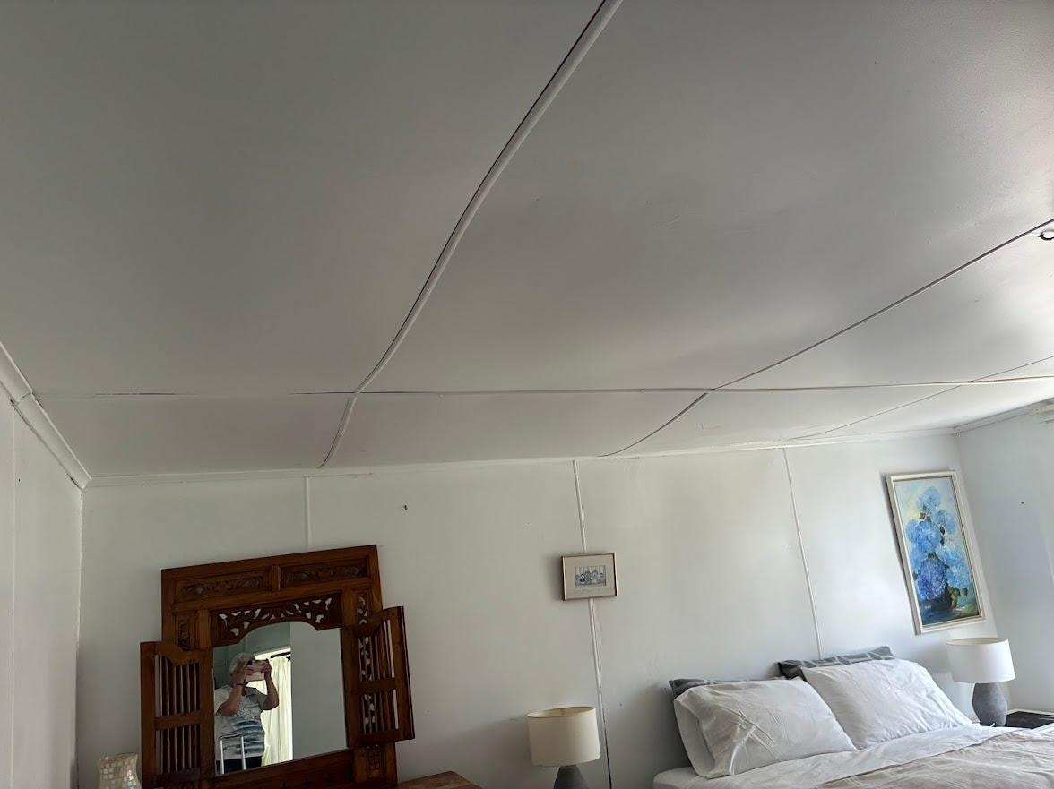 The ceiling in the main bedroom looked like it was about to fall down.